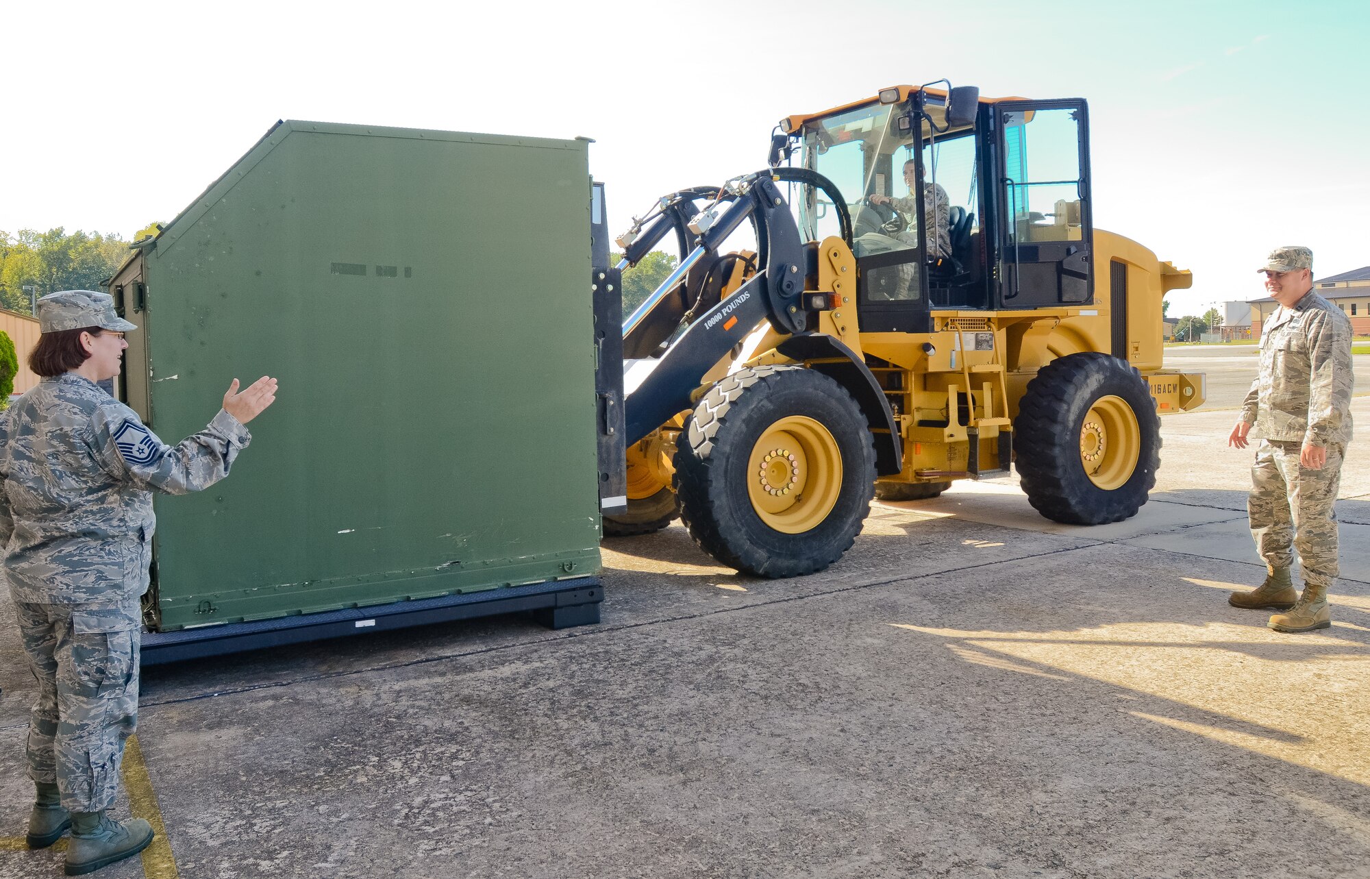 Airmen with the 116th Logistics Readiness Squadron Deployment Distribution Flight, Georgia Air National Guard, move an Internal Airlift/Helicopter Slingable-Container Unit during a Unit Training Assembly at Robins Air Force Base, Ga. Oct. 19, 2014.   These logistics planners are part of a six-member team that are responsible for implementing plans to move people, cargo and military assets downrange.  When personnel return home from deployment, the planners switch gears to the reintegration phase of their job, ensuring all members have the necessary resources for a successful transition. (U.S. Air National Guard photo by Senior Airman Kari Giles/Released)