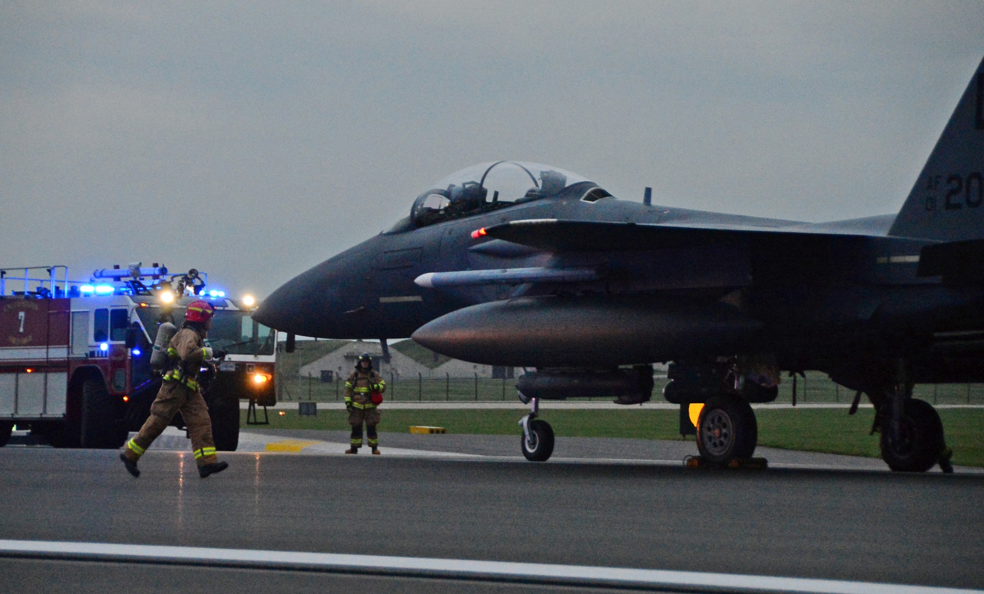 An F-15E Strike Eagle assigned to the 494th Fighter Squadron catches a cable during the certification process of new aircraft arrest barrier engagement systems on the runway at Royal Air Force Lakenheath, England, Oct. 15, 2014. The replacement system was installed on the flightline and is undergoing a certification process, saving the Air Force money and ensuring optimum safety of 48th Fighter wing assets. (U.S. Air Force photo by Airman 1st Class Erin O’Shea/Released) 