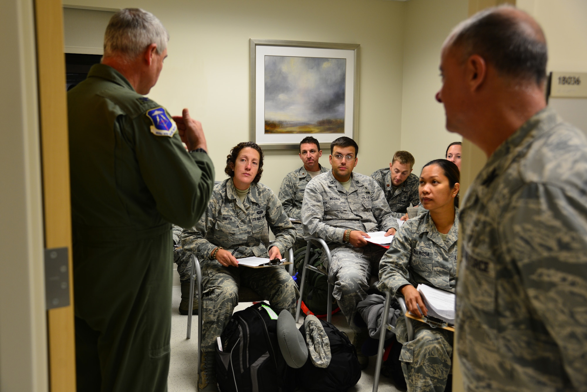 U.S. Air Force Col. Wayne M. Pritt, 633rd Medical Group commander, briefs redeployers at Langley Air Force Base, Va., Oct. 20, 2014. The team of 34, part of United States Africa Command’s Joint Task Force United Assistance, constructed an expeditionary field hospital for the U.S. Public Health Service's use in caring for international medical workers. The facility can treat an at-risk population of up to 6,500.  (U.S. Air Force photo by Senior Airman Aubrey White/Released)