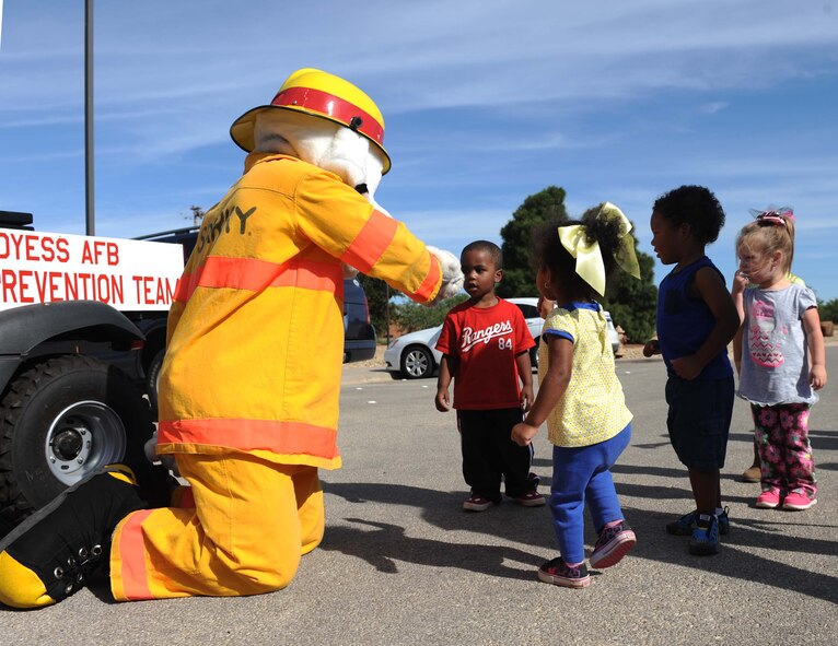 Sparky, the National Fire Prevention mascot, interacts with children from the Dyess Air Force Base Child Development Center Oct. 9, 2014 at Dyess Air Force Base, Texas. Sparky visited the base for National Fire Prevention week. The week focuses on the importance of precautionary acts in order to prepare members of the base in the event of a fire. This year’s theme is “Smoke alarms save lives: test yours every month.” (U.S. Air Force photo by Airman 1st Class Autumn Velez/Released)