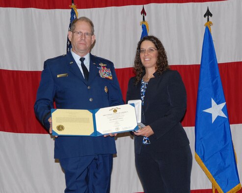 Nevada Adjutant General, Brig. Gen. William Burks (left), presents the 
Airman's Medal  to Sharon Landsberry during a ceremony on Sunday at the 
Reno-Sparks Convention Center.  Sharon's husband, Master Sgt. Michael 
Landsberry, gave his life to save his students during a shooting incident on 
21 Oct. 2013, at Sparks Middle School.  USAF photo by Senior Airman Ashif Halim.  (RELEASED) 
