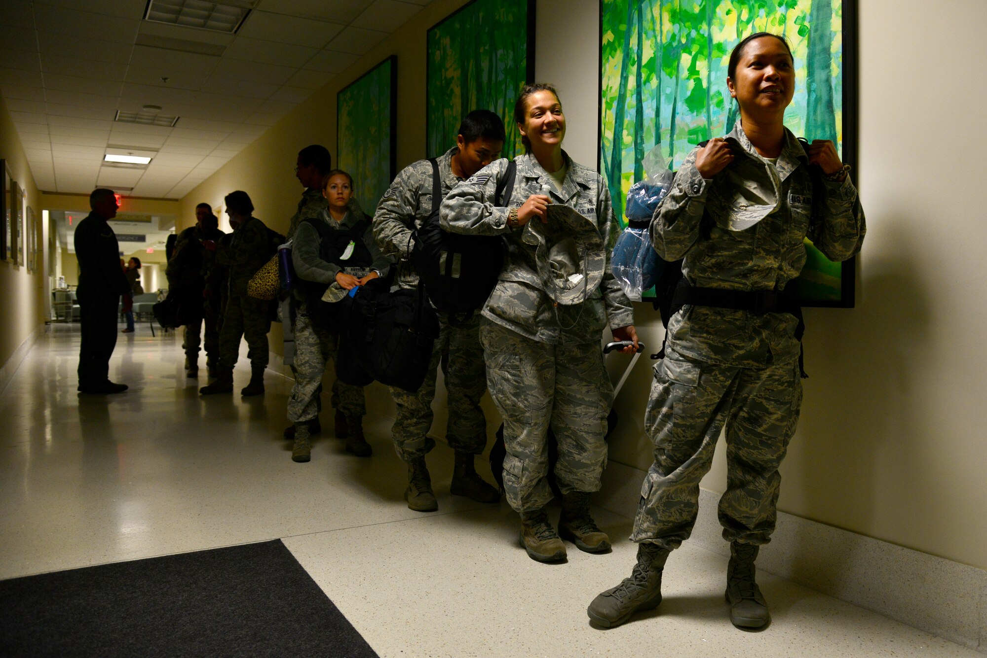 U.S. Air Force Airmen assigned to the 633rd Medical Group prepare for briefings and initial evaluations upon their return from a nearly one-month deployment to West Africa, at Langley Air Force Base, Va., Oct. 20, 2014. None of the Airmen have exhibited symptoms of the Ebola Virus Disease, and all are considered to have no known exposure to the disease. (U.S. Air Force photo by Senior Airman Aubrey White/Released)