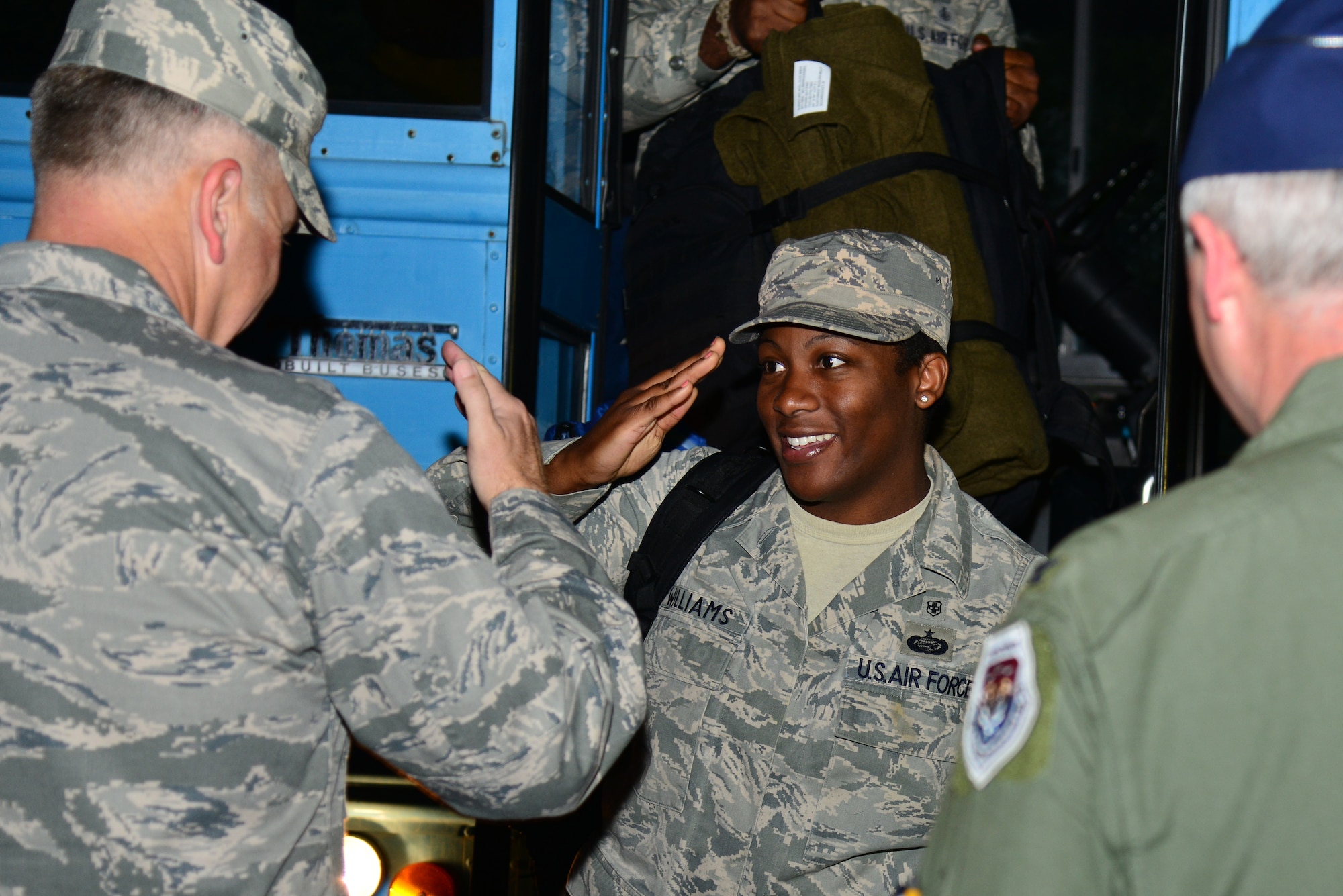U.S. Air Force Staff Sgt. Fanta Williams, 633rd Medical Operations Squadron medic, salutes Col. John J. Allen Jr., 633rd Air Base Wing commander, during a homecoming ceremony at Langley Air Force Base, Va., Oct. 20, 2014. Airmen assigned to the 633rd Medical Group deployed to West Africa in support of Operation United Assistance, where they delivered and built the Air Force’s Expeditionary Medical Support System. (U.S. Air Force photo by Senior Airman Aubrey White/Released)