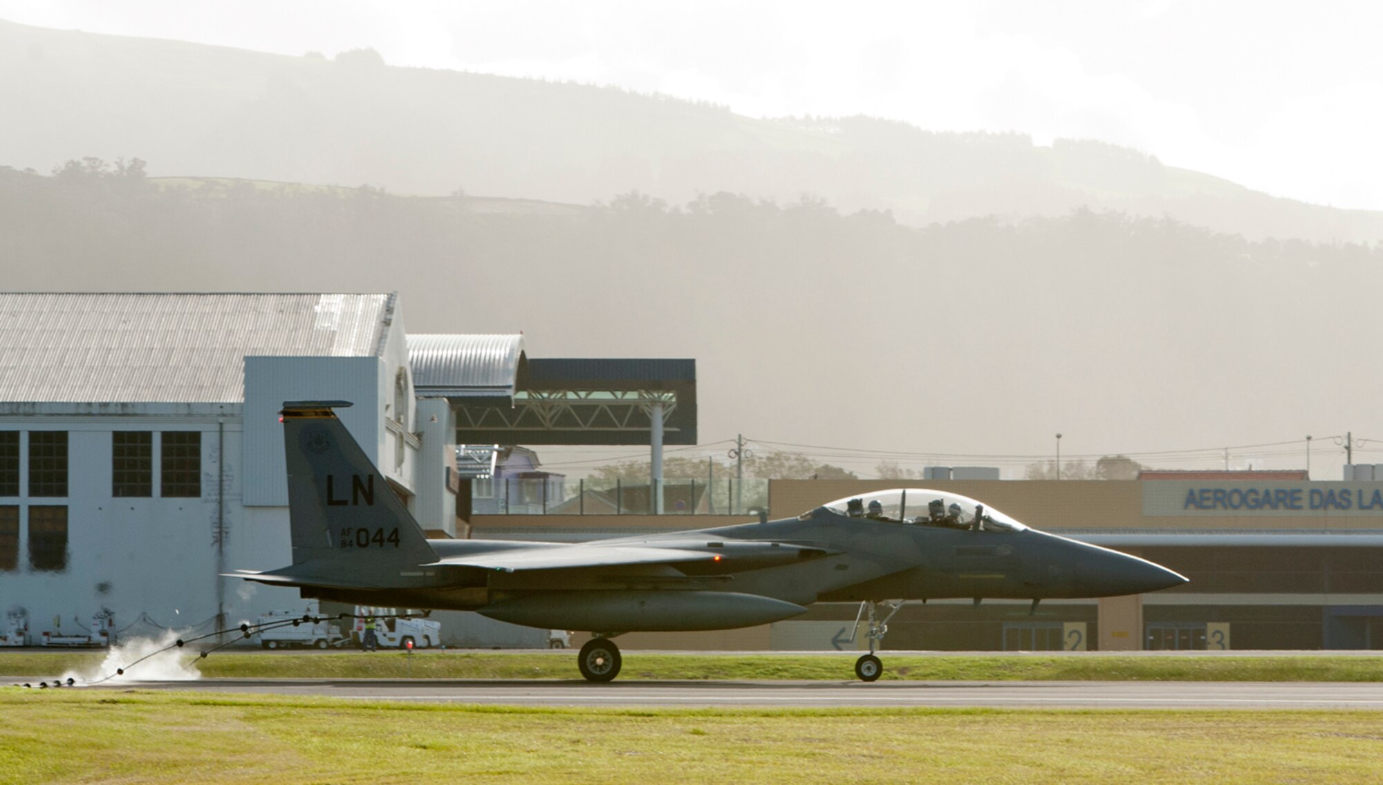 An F-15 Eagle from Royal Air Force Lakenheath, England, catches a pendant to test and certify the 65th Air Base Wing’s barrier arresting kit on Lajes Field, Azores, Portugal, Oct. 17, 2014. The barrier arresting kit certification is an annual requirement and is designed to prevent a crash during emergency situations. (U.S. Air Force photo by Tech. Sgt. Bradley C. Church).
