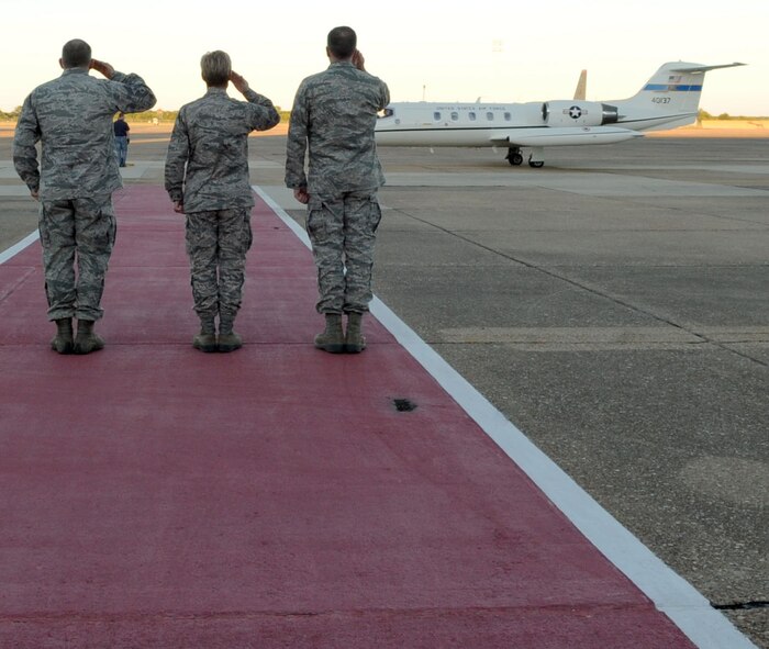 Maj. Gen. Scott Vander Hamm, 8th Air Force commander, Col Kristin Goodwin, 2nd Bomb Wing commander and Chief Master Sgt. Thomas Mazzone, 2nd BW command chief, salute as Eric Fanning, Under Secretary of the Air Force, taxis into Barksdale Air Force Base, La., Oct. 16, 2014. Fanning visited Barksdale to get a better understanding of the B-52H Stratofortress mission and the history of the base. (U.S. Air Force photo/Senior Airman Kristin High)