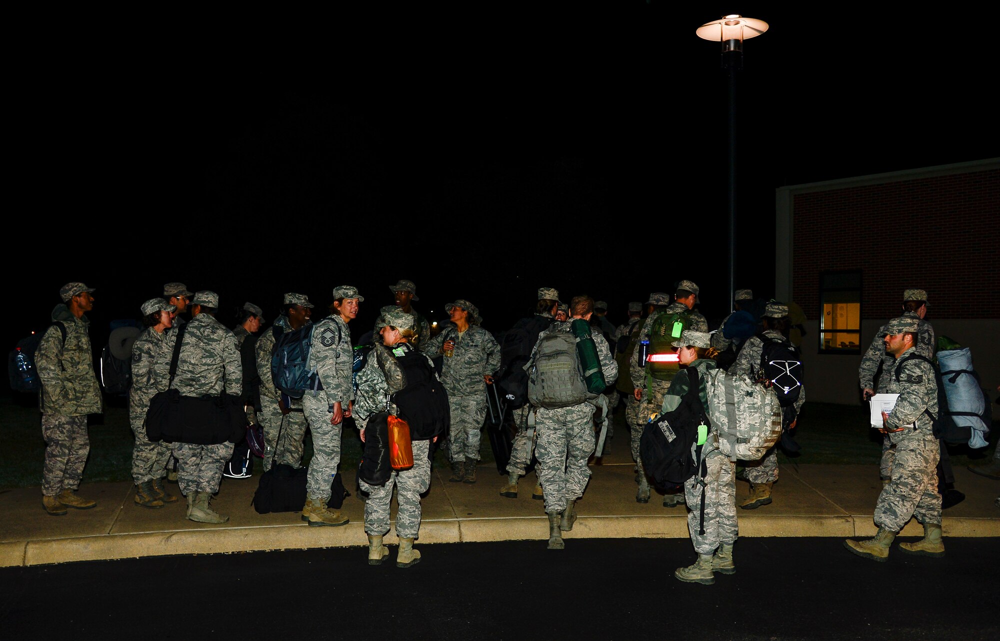 U.S. Air Force Airmen assigned to the 633rd Medical Operations Squadron return from a deployment to West Africa at Langley Air Force Base, Va., Oct. 20, 2014. The Airmen were deployed to West Africa to deliver a modular medical treatment facility and train international healthcare workers to use the equipment. (U.S. Air Force photo by Senior Airman Kayla Newman/Released)