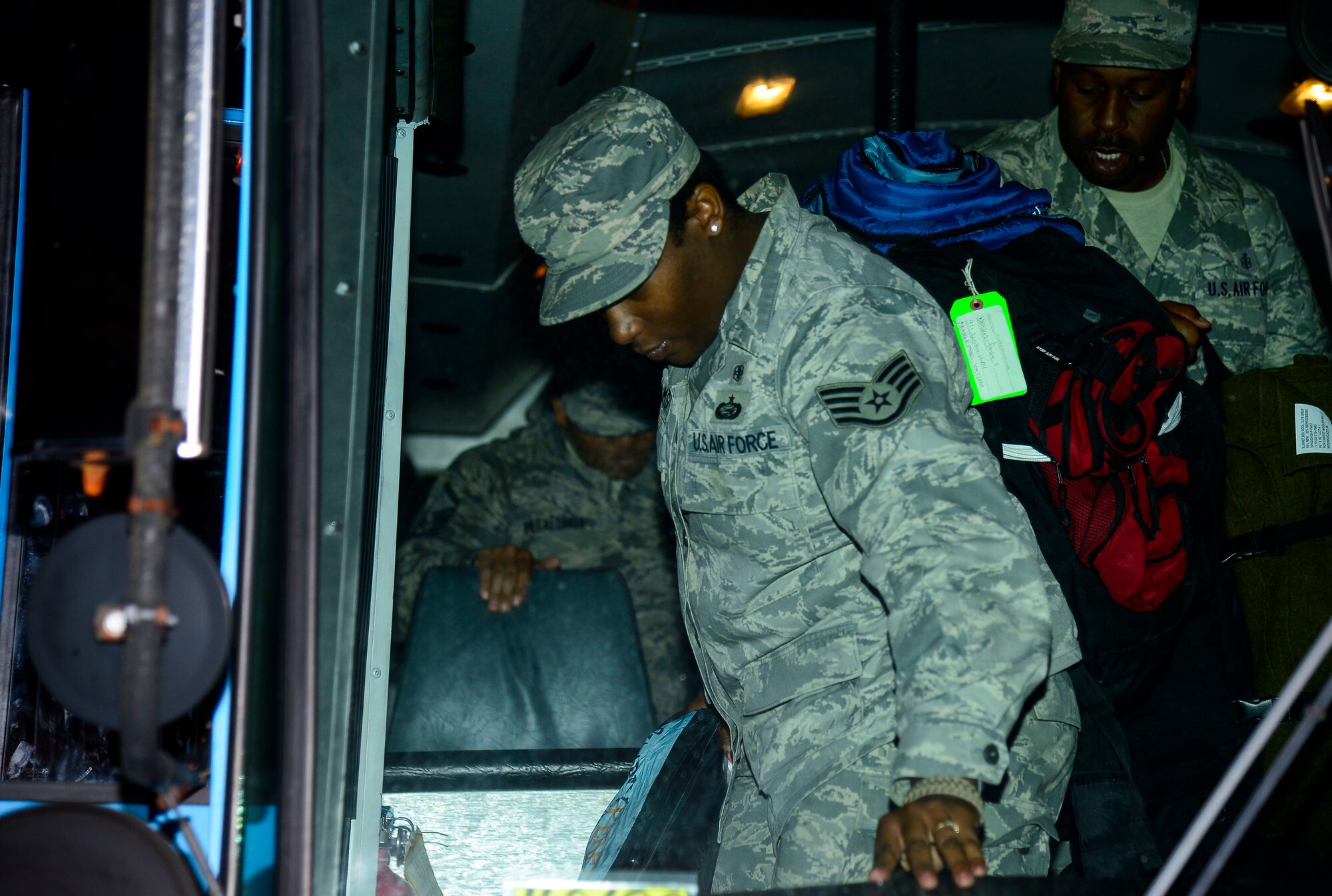 U.S. Air Force Airmen assigned to the 633rd Medical Group exit a bus in front of USAF Hospital Langley at Langley Air Force Base, Va., Oct. 20, 2014. Airmen returned from setting up an Expeditionary Medical Support System in West Africa as part of Operation United Assistance. (U.S. Air Force photo by Senior Airman Kayla Newman/Released)
