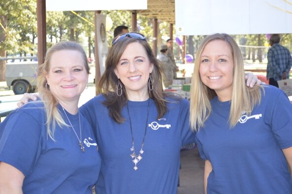 NAVAL AIR STATION FORT WORTH JOINT RESERVE BASE, Texas - Three of the 301st Key Spouse STARS, Annette Mallard, Karen Breazeale and Amelia McMillen, pose for a quick photo during the wing's Family Day here Oct. 4, 2014. As America's Citizen Airmen, balancing Reserve-work-life is crucial to wing success. Part of helping that balance is the Key Spouse program designed to ensure spouses are connected to the 301st and receive the resources they need. For more information on our Key Spouse STARS program, email 301st.spouses@gmail.com, like Fort Worth Key Spouse on Facebook, or follow @301FW_KeySpouse on Twitter. (Courtesy Photo)