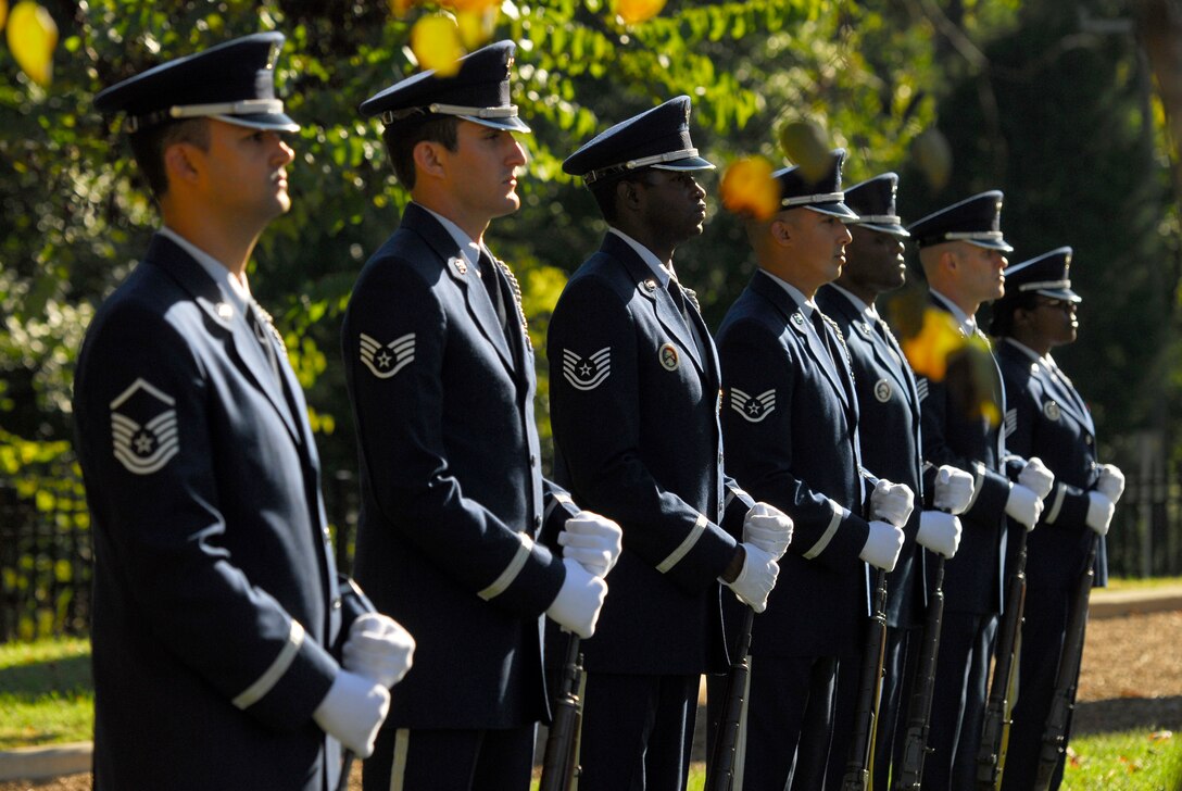 Members of the Honor Guard stand at parade rest before the start of the Memorial Wall Ceremony held at the North Carolina Air National Guard Base, Charlotte Douglas Intl. Airport, Oct. 5, 2014. Additional names of those who’ve passed are added to the monument each year as a lasting tribute to those individuals who have helped establish the proud tradition upon which the North Carolina Air National Guard is built. (U.S. Air National Guard photo by Staff Sgt. Julianne M. Showalter, 145th Public Affairs/Released)