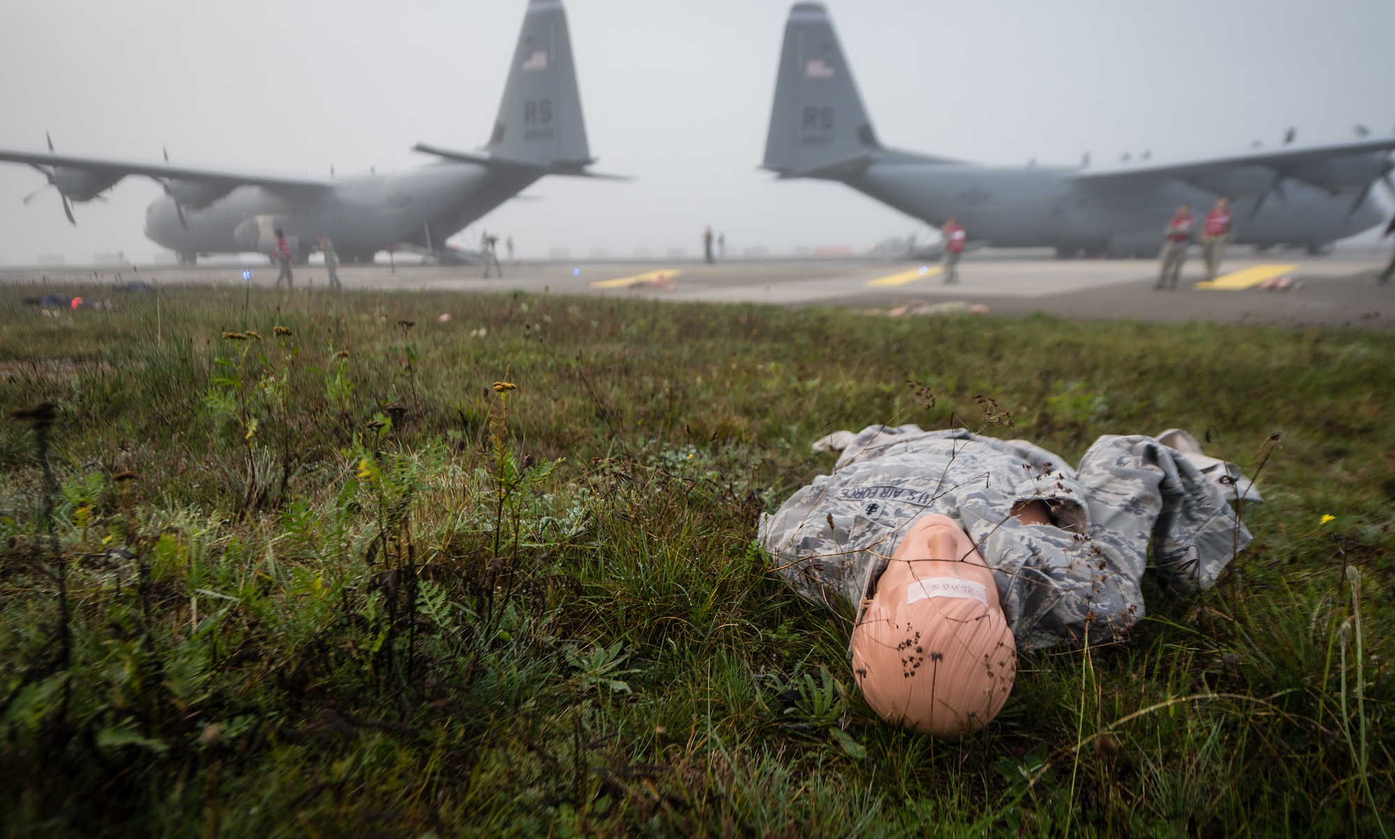 A simulated casualty lays in a field next to the flightline as part of a major accident response exercise on Ramstein Air Base, Germany, Oct. 18, 2014Members of the Air Force and host nation agencies partnered in conducting a response and recovery in preparation for possible real-world incidents. (U.S. Air Force photo/Airman 1st Class Jordan Castelan)