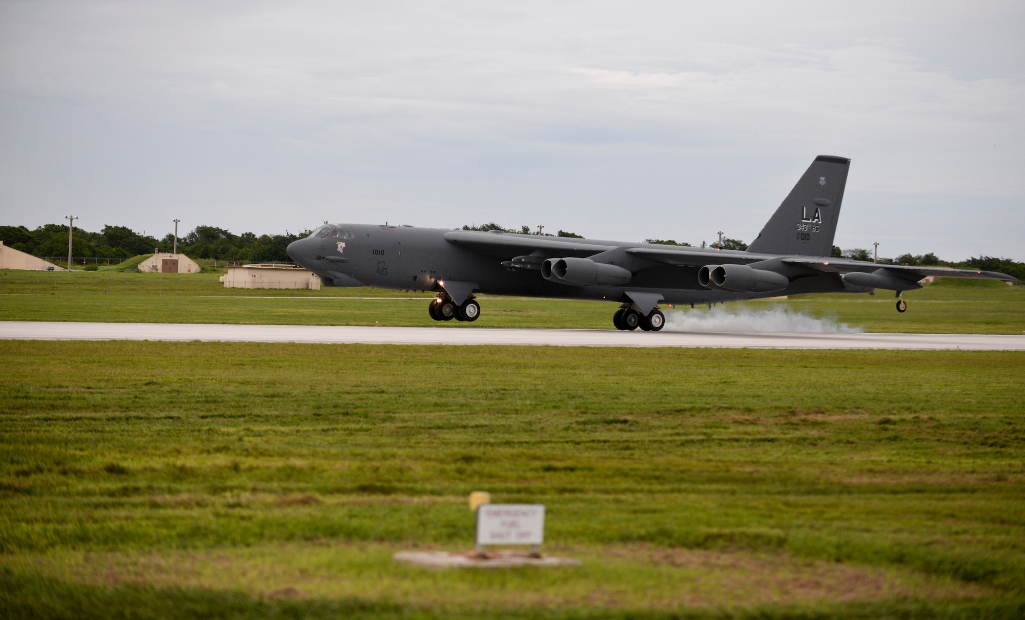 A B-52 Stratofortress piloted by Lt. Col. Steve Smith, 93rd Bomb Squadron from Barksdale Air Force Base, La., lands Oct. 8, 2014, at Andersen Air Force Base, Guam. Smith reached the 9,000 flying-hour mark, leaving him with the most flying hours in a 52H; the next aviator is 2,000 hours behind him. (U.S. Air Force photo by Staff Sgt. Robert Hicks/Released) 