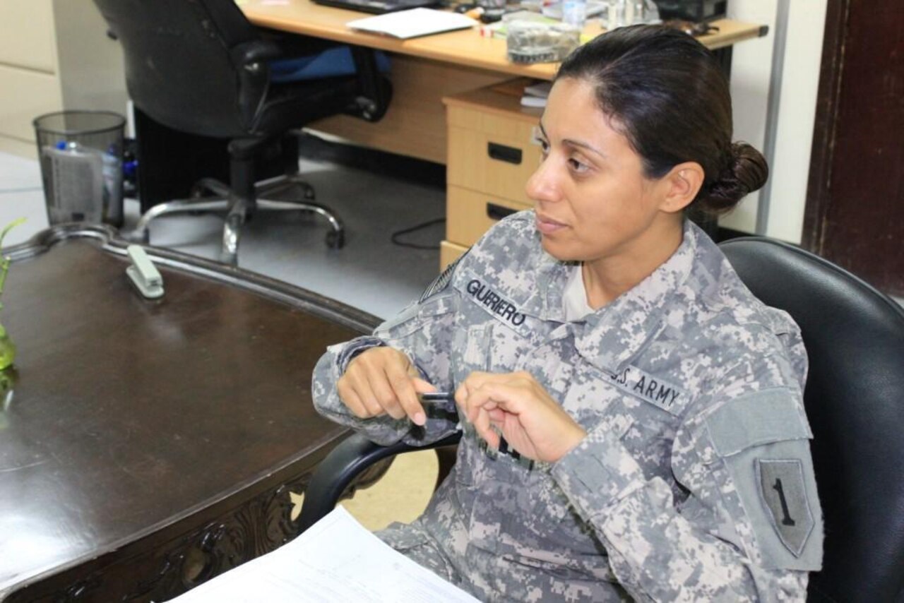 Army Capt. Susana Guerrero, a behavioral health officer, listens intently as one of her soldiers discusses the day’s cases at Camp Buehring, Kuwait, Oct. 3, 2014. The El Salvador native immigrated to the United States with her family in 1980 and has served in the military for more than 10 years. U.S. Army photo by Maj. Fredrick Williams