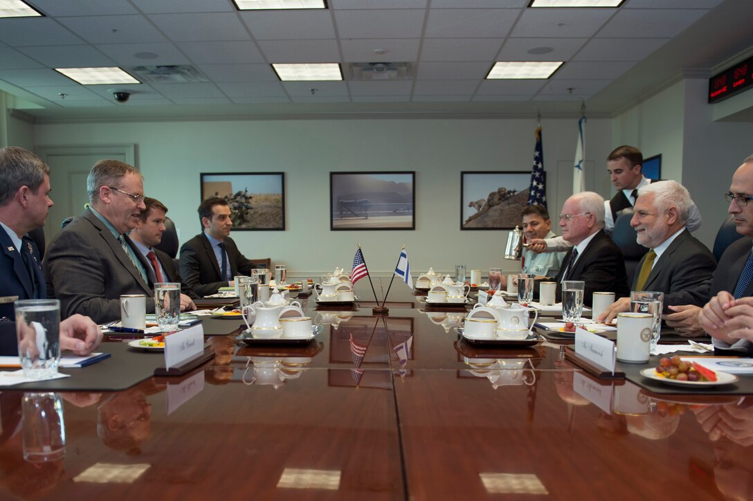 U.S. Deputy Defense Secretary Bob Work, second from left, meets with Dan Harel, second from right, director general of Israel's defense ministry, at the Pentagon, Oct. 20, 2014.