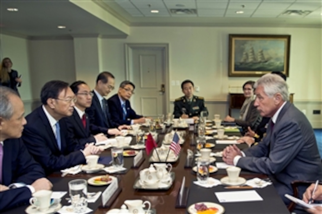 U.S. Defense Secretary Chuck Hagel, right, meets with Chinese State Councilor Yang Jiechi, second from left, at the Pentagon, Oct. 20, 2014, to discuss matters of mutual importance.