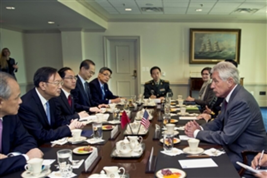 U.S. Defense Secretary Chuck Hagel, right, meets with Chinese State Councilor Yang Jiechi, second from left, at the Pentagon, Oct. 20, 2014, to discuss matters of mutual importance.