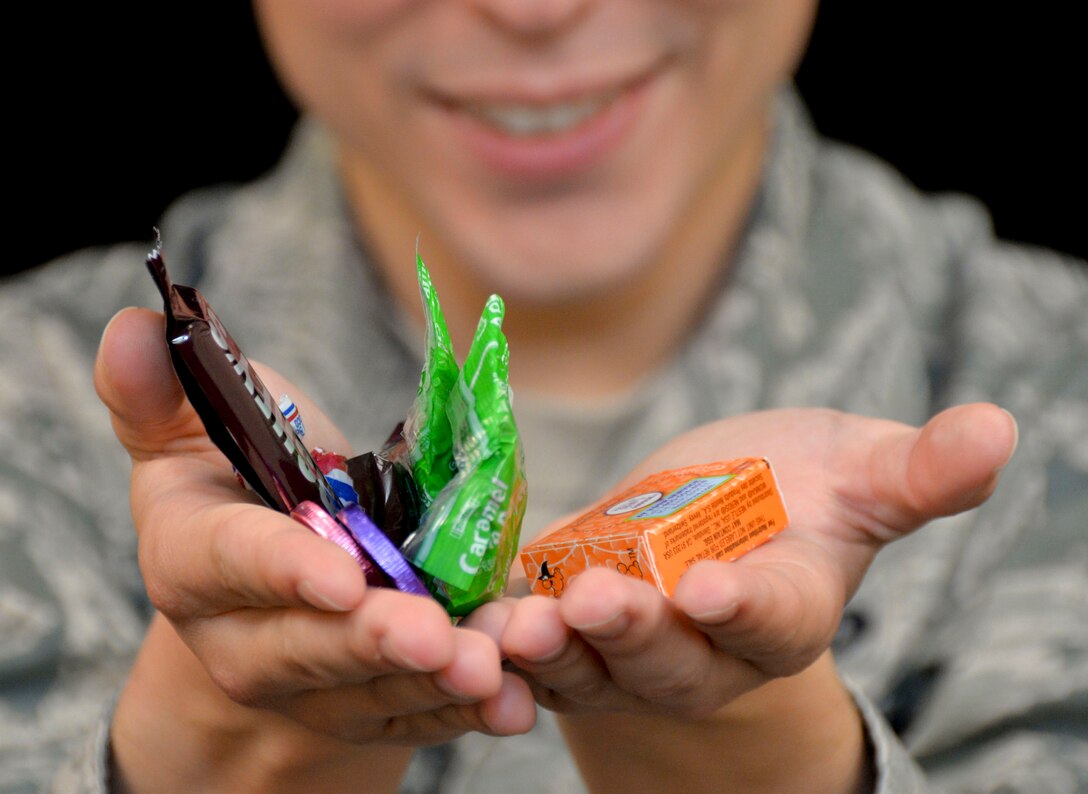 An airman poses a photo on Barksdale Air Force Base, La., Oct. 20, 2014. As ghosts, witches and superheroes stock up on candy Team Barksdale?s dental professionals highlight the risks of tooth decay and advise children to maintain proper dental hygiene this Halloween. (U.S. Air Force photo/Airman 1st Class Mozer O. Da Cunha)