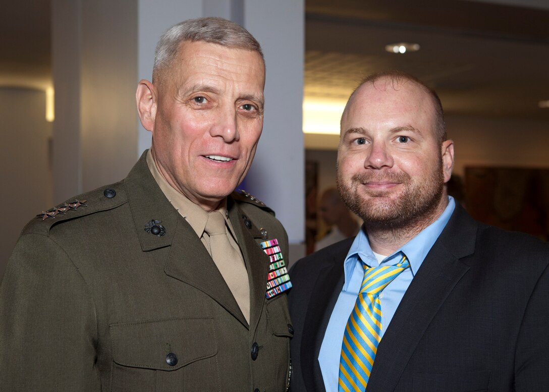 The Assistant Commandant of the Marine Corps, Gen. John M. Paxton, Jr., left, poses for a photo with a guest at the Embassy of Australia in Washington, D.C., Oct. 17, 2014. The Ambassador of Australia, Kim Beazley, hosted a dinner event in honor of U.S. wounded service members. (U.S. Marine Corps photo by Cpl. Tia Dufour/Released) 