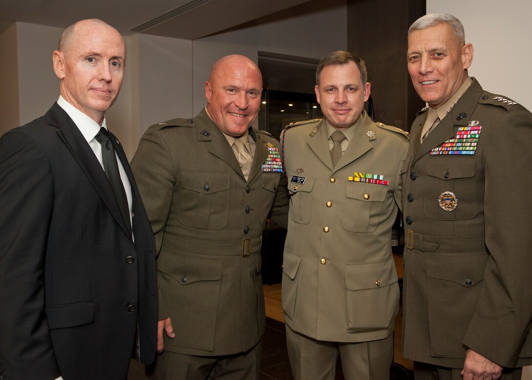 The Assistant Commandant of the Marine Corps, Gen. John M. Paxton, Jr., right, poses for a photo with guests at the Embassy of Australia in Washington, D.C., Oct. 17, 2014. The Ambassador of Australia, Kim Beazley, hosted a dinner event in honor of U.S. wounded service members. (U.S. Marine Corps photo by Cpl. Tia Dufour/Released) 