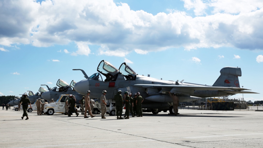 Marines of Marine Tactical Electronic Warfare Training Squadron 1 inspect and prepare seven EA-6B Prowlers fly to fly in formation over Marine Corps Air Station Cherry Point, N.C., Oct. 16, 2014. The flights were the first in Marine Corps aviation history to have seven Prowlers from the same squadron fly together in formation. The Marines of Marine Tactical Electronic Warfare Training Squadron 1 conducted the fly-bys in celebration of recently being named the recipient of the 2014 Association of Old Crows Marine Corps outstanding unit award.