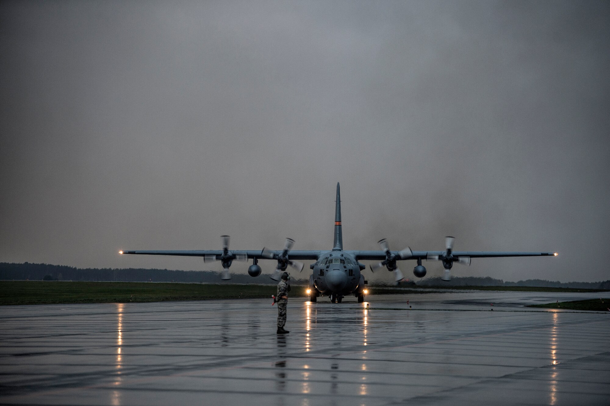 A C-130 Hercules taxi on the flightline Oct. 20, 2014, during U.S. Air Force Aviation Detachment rotation 15-1, at Powidz Air Base, Poland. The C-130s are assigned to Illinois Air National Guard’s 182nd Airlift Wing. The guardsmen’s night mission performed on-station training to test their capability to perform missions in low-light sorties. The U.S. Air Force’s forward presence in Europe allows allies and partners to develop and improve ready air forces capable of maintaining regional security. (U.S. Air Force photo/Staff Sgt. Christopher Ruano)