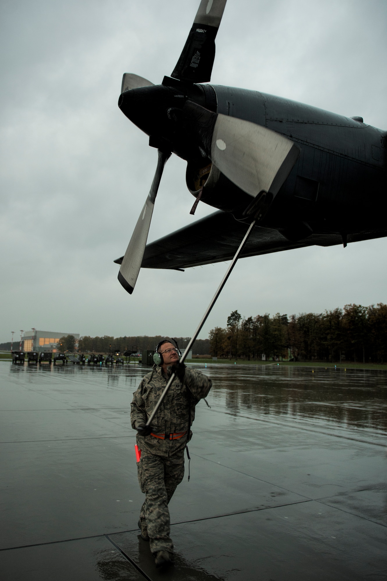 Tech. Sgt. Press Chapin positions the propeller of a C-130 Hercules Oct. 20, 2014, at Powidz Air Base, Poland. The Illinois Air National Guard and Polish airmen have learned and worked together for more than 20 years on a variety of exercises and events, building interoperability through the partnership program. Chapin is a crew chief with the Illinois ANG’s 182nd Airlift Wing. (U.S. Air Force photo/Staff Sgt. Christopher Ruano)