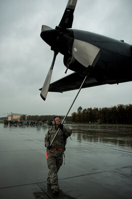 Tech. Sgt. Press Chapin positions the propeller of a C-130 Hercules Oct. 20, 2014, at Powidz Air Base, Poland. The Illinois Air National Guard and Polish airmen have learned and worked together for more than 20 years on a variety of exercises and events, building interoperability through the partnership program. Chapin is a crew chief with the Illinois ANG’s 182nd Airlift Wing. (U.S. Air Force photo/Staff Sgt. Christopher Ruano)