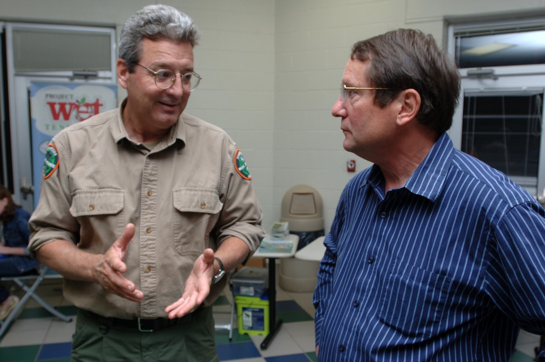 Tim Higgs (Right), chief of the U.S. Army Corps of Engineers Nashville District Planning Branch’s Environmental Section, talks with David Sims, a habitat biologist with the Tennessee Wildlife Resources Agency, during a Stones River watershed workshop Oct. 20, 2014 at Patterson Park Community Center in Murfreesboro, Tenn. The event was sponsored by the Tennessee Department of Environment and Conservation.