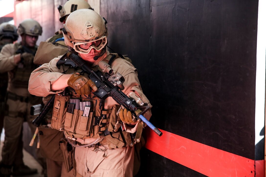 U.S. Marine Staff Sgt. Michael Liddle prepares to enter a room during a close-quarters tactics course aboard Camp Pendleton, Calif., Oct. 15, 2014. Liddle is a team leader with the Force Reconnaissance Detachment, 15th Marine Expeditionary Unit, which is scheduled to deploy next spring. (U.S. Marine photo by Cpl. Anna Albrecht/Released)