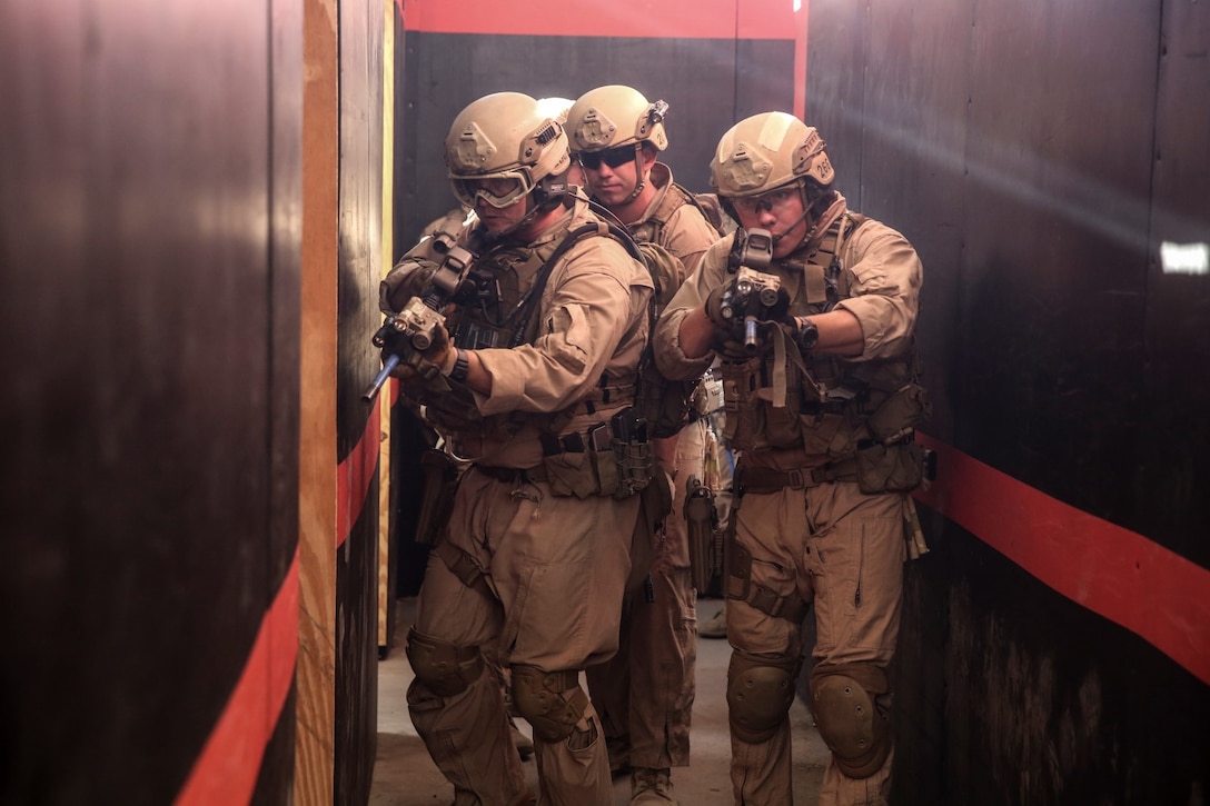 U.S. Marines with the Force Reconnaissance Detachment, 15th Marine Expeditionary Unit, clear rooms during a close-quarters tactics course aboard Camp Pendleton, Calif., Oct. 15, 2014. The Force Recon Detachment is scheduled to deploy with the 15th MEU next spring. (U.S. Marine photo by Cpl. Anna Albrecht/Released)