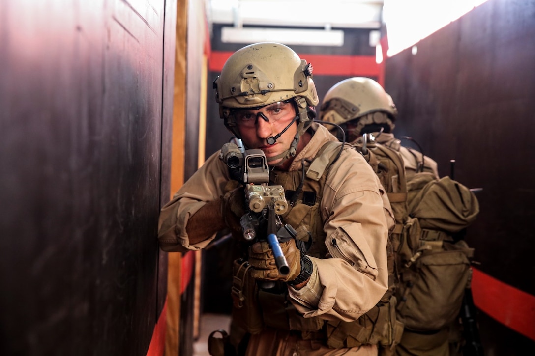 U.S. Marine Capt. Benjamin Howe provides security during a close-quarters tactics course aboard Camp Pendleton, Calif., Oct. 15, 2014. Howe is a company commander with the Force Reconnaissance Detachment, 15th Marine Expeditionary Unit, which is scheduled to deploy next spring. (U.S. Marine photo by Cpl. Anna Albrecht/Released)