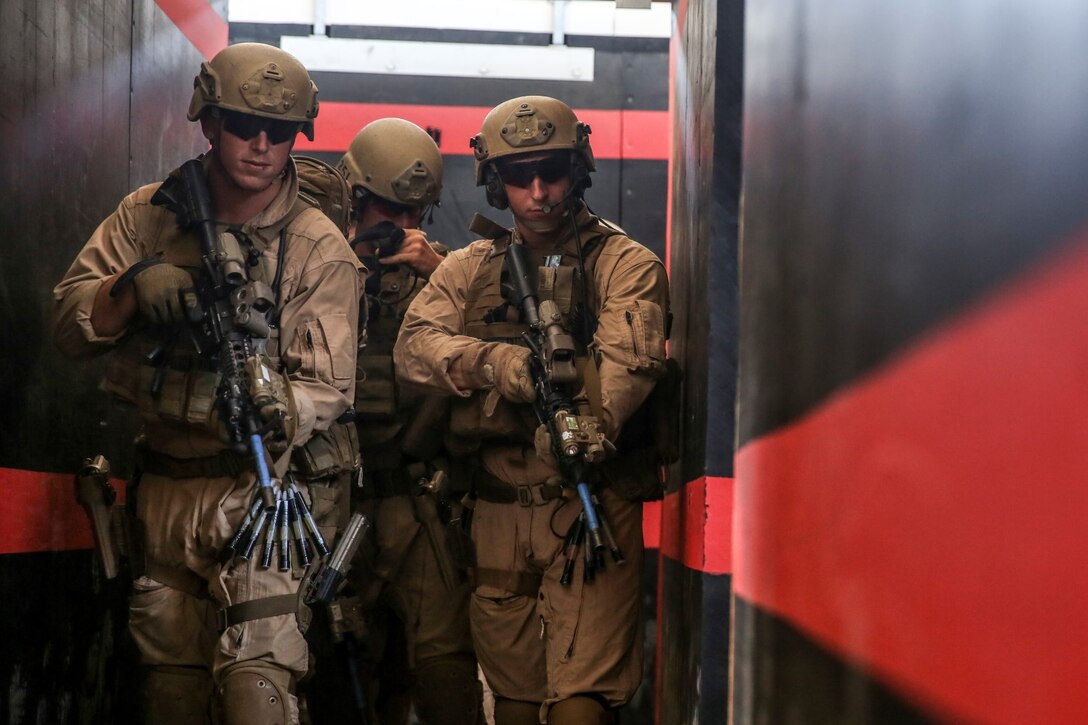 U.S. Marines with the Force Reconnaissance Detachment, 15th Marine Expeditionary Unit, clear rooms during a close-quarters tactics course aboard Camp Pendleton, Calif., Oct. 15, 2014. The Force Recon Detachment is scheduled to deploy with the 15th MEU next spring. (U.S. Marine photo by Cpl. Anna Albrecht/Released)
