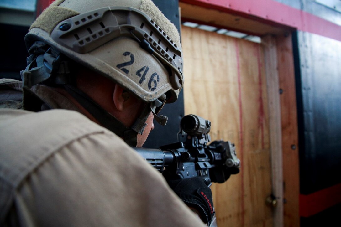 U.S. Marine Sgt. Guy Higgins prepares to enter a room during a close-quarters tactics course aboard Camp Pendleton, Calif., Oct. 15, 2014. Higgins is a sniper with Force Reconnaissance Detachment, 15th Marine Expeditionary Unit, which is scheduled to deploy next spring. (U.S. Marine photo by Cpl. Steve H. Lopez/Released)