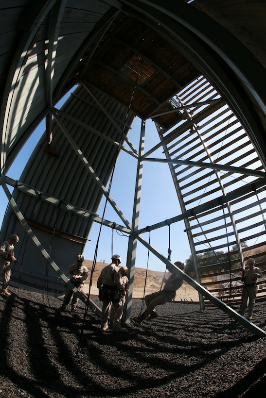 U.S. Marines with Battalion Landing Team, 3rd Battalion, 1st Marine Regiment, practice rappelling during a helicopter rope-suspension techniques masters course aboard Camp Pendleton, Calif., Oct. 14, 2014. BLT 3/1 is deploying this spring as the 15th Marine Expeditionary Unit’s ground combat element. (U.S. Marine Corps photo by Sgt. Jamean Berry/Released)