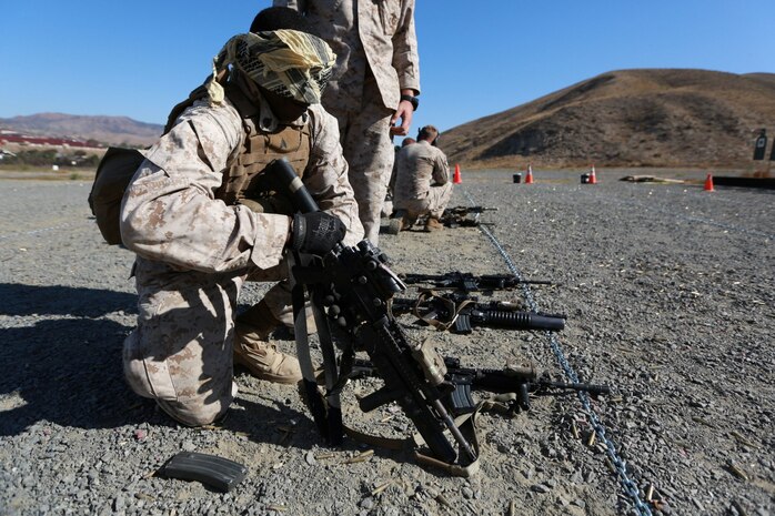 U.S. Marine Sgt. James Brooks conducts malfunction drills during a raid-leaders course aboard Camp Pendleton, Calif., Oct. 8, 2014. Brooks, 24, from Cincinnati, Ohio, is an anti-tank missileman with 3rd Battalion, 1st Marine Regiment. Marines with 3/1 are the Battalion Landing Team with the 15th Marine Expeditionary Unit. (U.S. Marine photo by Cpl. Steve H. Lopez/ NotReleased)