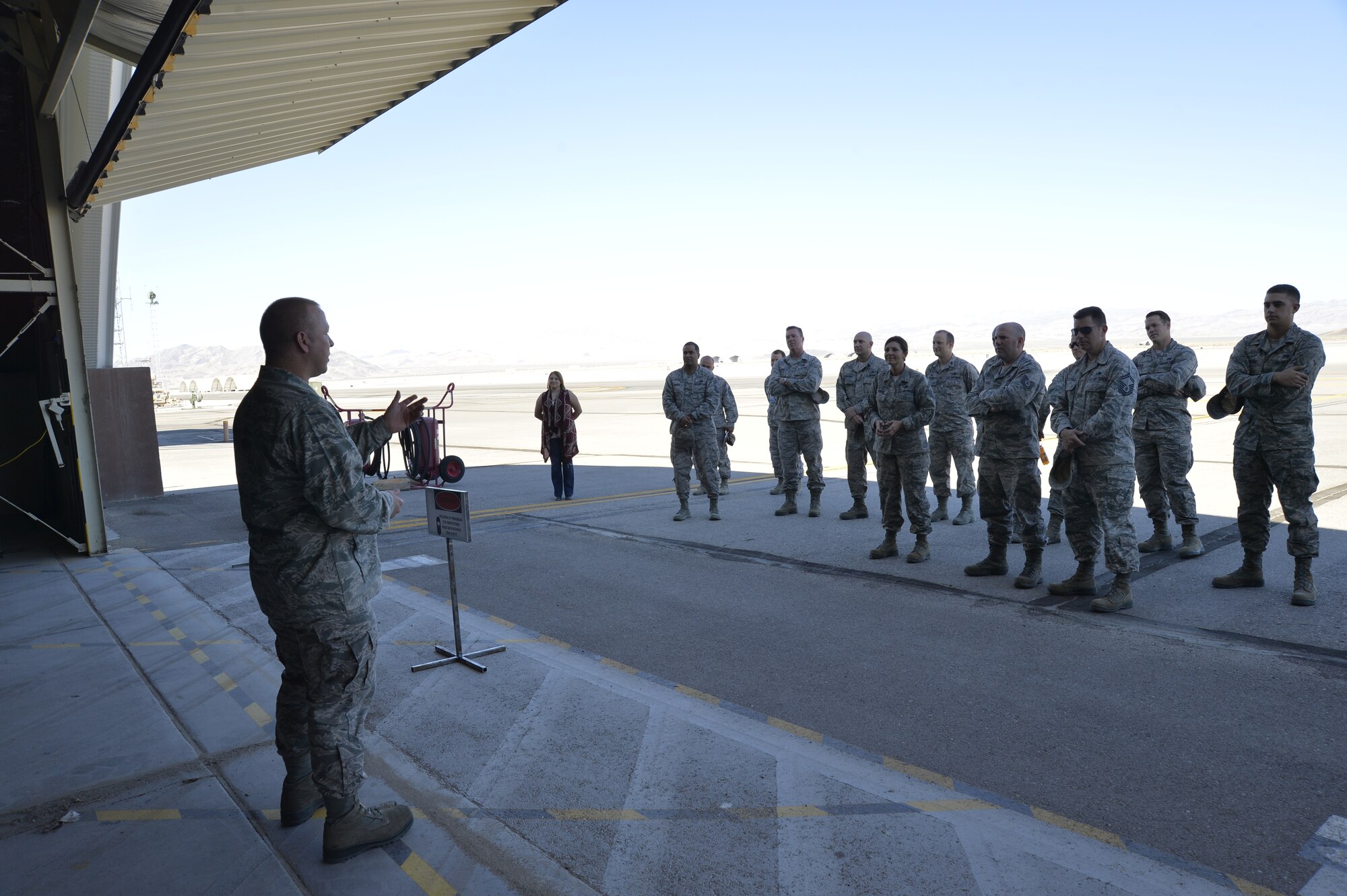 Maj. Timothy Casey, 432nd Maintenance Squadron commander, gives a speech after the squadron’s new aircraft metals technology section facility “ribbon” cutting Oct. 9, 2014, at Creech Air Force Base, Nevada. The new facility has the capability to manufacture parts and tools for aircraft and different units around base. (U.S. Air Force photo by Staff Sgt. Adawn Kelsey/released)
