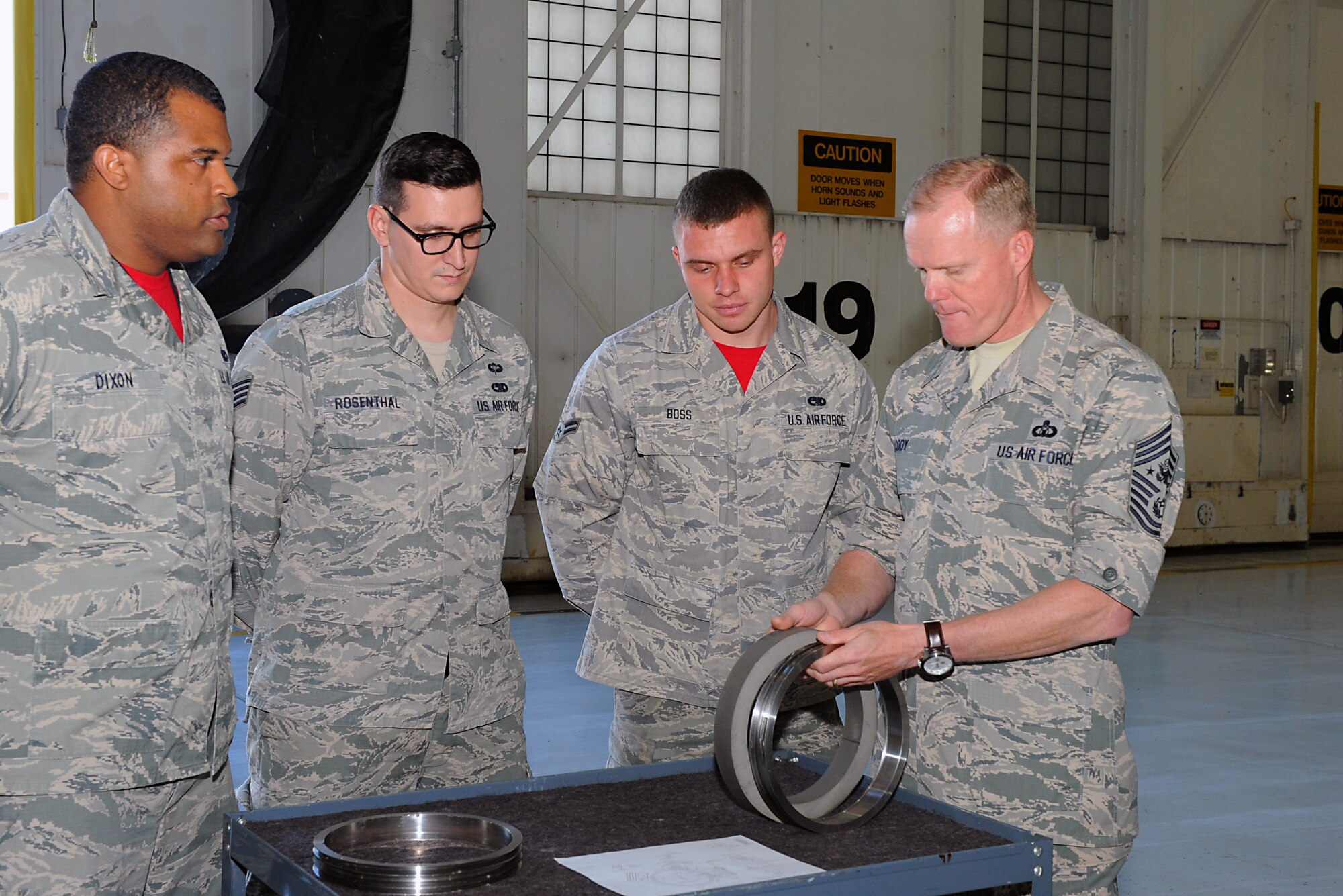Chief Master Sgt. of the Air Force James A. Cody inspects a boom azimuth pulley, Oct. 17, 2014, at McConnell Air Force Base, Kan. The Air Force's most senior enlisted member visited McConnell to speak with enlisted Airmen during duty section visits. (Air Force photo/Airman 1st Class David Bernal Del Agua)