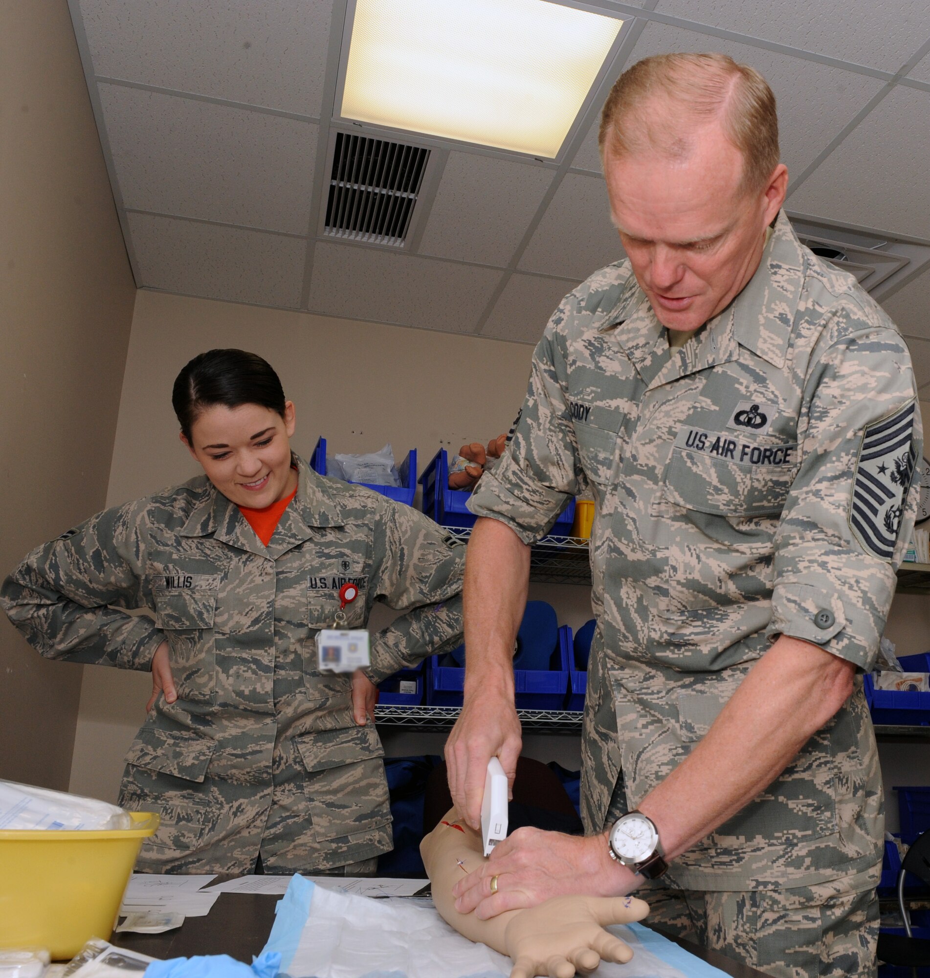 Chief Master Sgt. of the Air Force James A. Cody staples a simulated wound shut, Oct. 17, 2014, at McConnell Air Force Base, Kan. The Air Force's most senior enlisted member is visiting McConnell to speak with enlisted Airmen during duty section visits. (Air Force photo/Airman 1st Class David Bernal Del Agua)