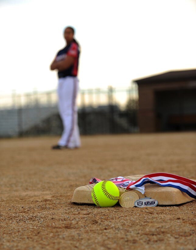 Senior Airman Nesha Humes poses with the gold and sliver medals at Joint Base Andrews, Md., Oct. 21, 2014. Airman Humes represented the U.S. Air Force as a member of the All-Air Force Women’s and All-Armed Forces Women’s Softball Teams Sept. 14 to 29, 2014. (U.S. Air Force photo/ Staff Sgt. Nichelle Anderson)