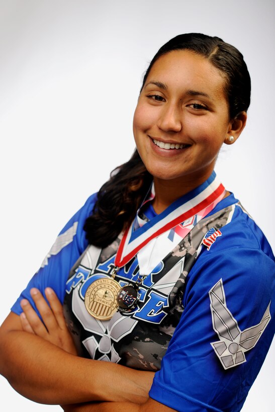 Senior Airman Nesha Humes poses with the gold and sliver medals at Joint Base Andrews, Md., Oct. 17, 2014. Airman Humes represented the U.S. Air Force as a member of the All-Air Force Women’s and All-Armed Forces Women’s Softball Teams Sept. 14 to 29, 2014. (U.S. Air Force photo/ Staff Sgt. Nichelle Anderson)