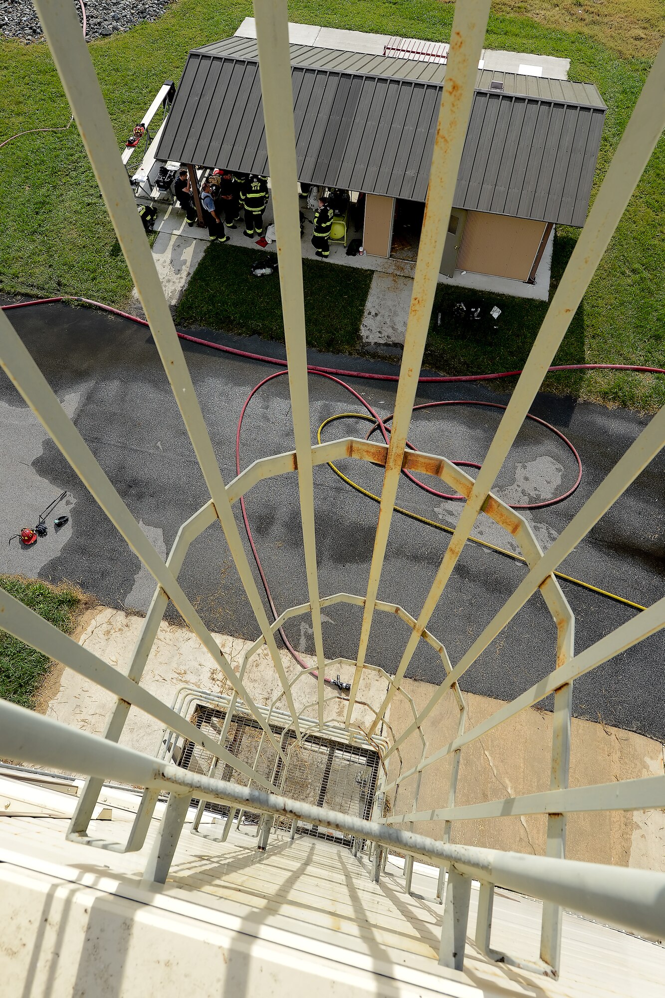 A vertical exterior ladder with safety cage is shown and can be used to access the roof of the 436th Civil Engineer Squadron Fire Department's structural fire training Oct. 20, 2014, at Dover Air Force Base, Del. A multi-story, specially-built fire training structure allows conditions to be controlled to maximize training and safety. (U.S. Air Force photo/Greg L. Davis)