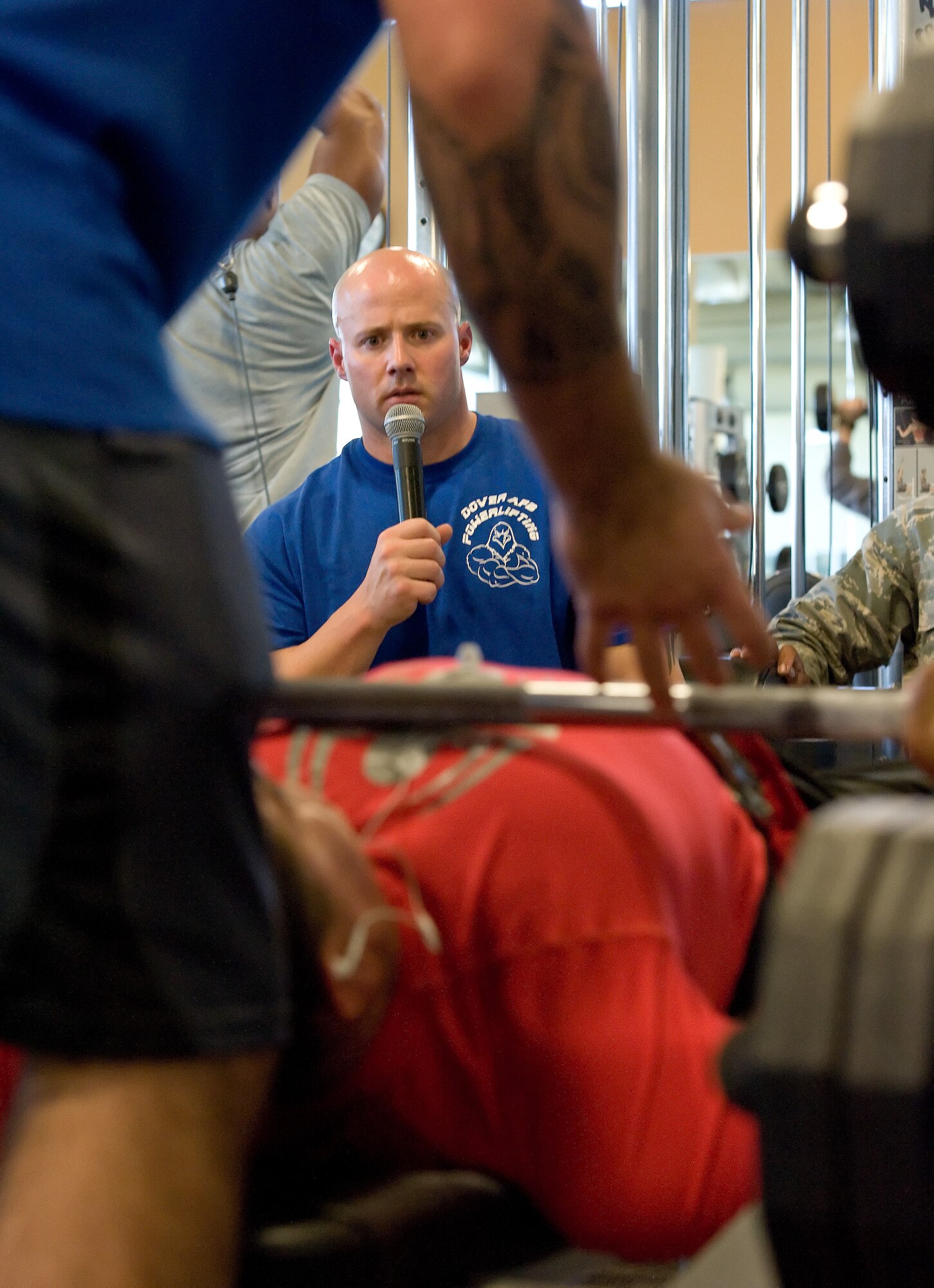 Zachary Replogle gives Dillon Shoemaker the command to press on one of his three bench press attempts during the 2014 Dover Air Force Base Powerlifting Competition Oct. 17, 2014, at the Fitness Center on Dover AFB, Del. Shoemaker took third place in the 198-pound weight class with a combined total of 1,065 pounds in the squat, bench press and deadlift. (U.S. Air Force photo/Roland Balik)