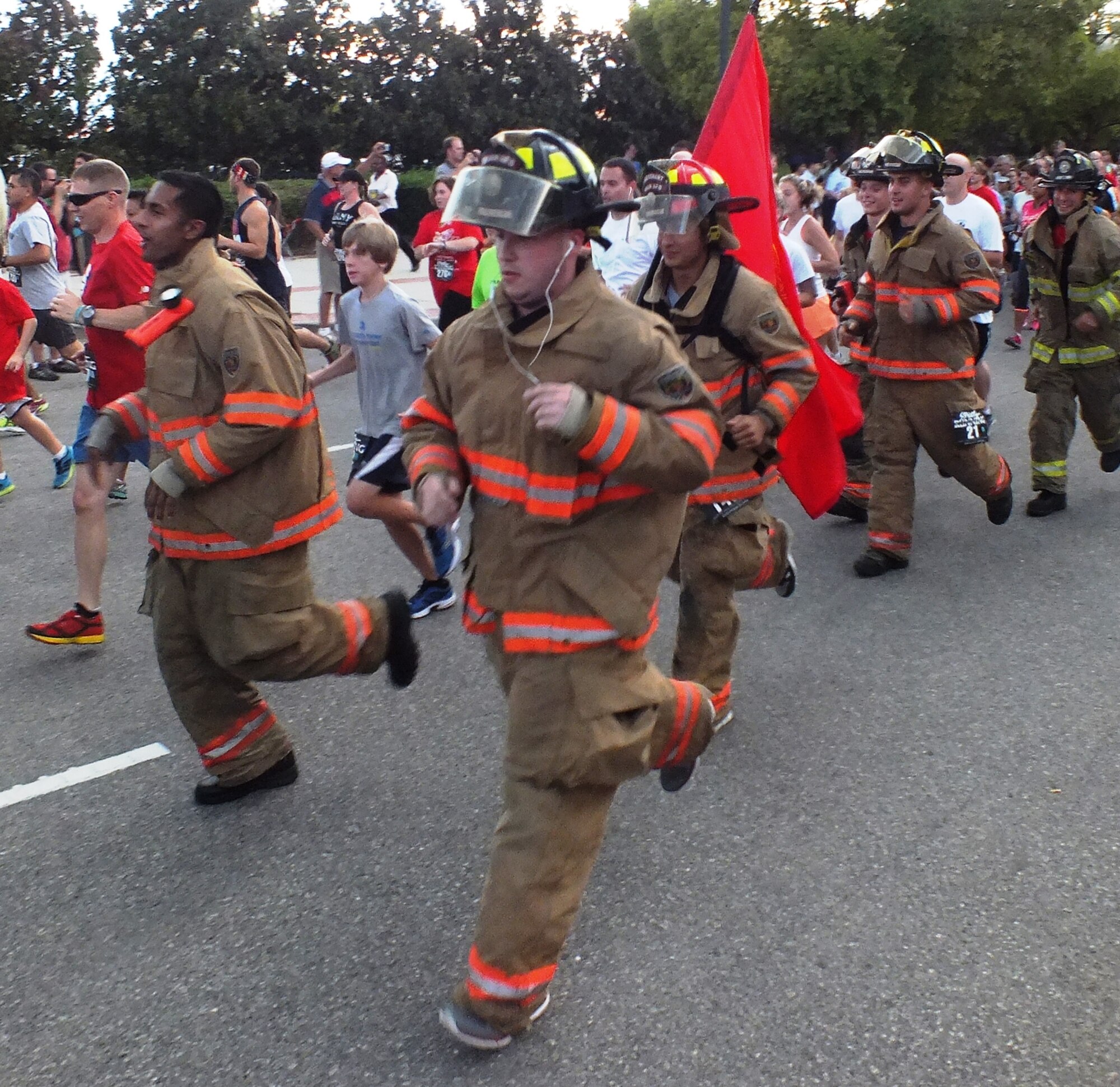 Airmen from the 20th Civil Engineer Squadron fire department run together during the Tunnel to Towers 5K run/walk in Columbia, S.C., Sept. 19, 2014. The event had approximately 3,000 participants which made it the second biggest turnout for this event. The purpose of the run was to get the members out to show their appreciation for the individuals who gave their lives during 9/11. (Courtesy photo/Released)