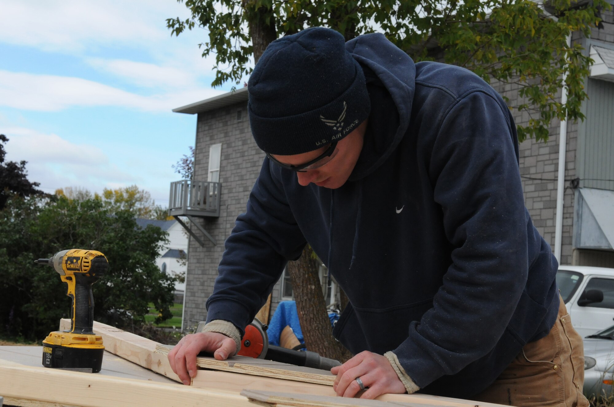 An airmen with the 148th Fighter Wing straightens a truss prior to construction Oct. 4, 2014.  Duluth based members of the Minnesota Air National Guard volunteered for their straight third year, working with Habitat for Humanity on community construction projects.  (U.S. Air National Guard photo by Tech. Sgt. Amie M. Muller)