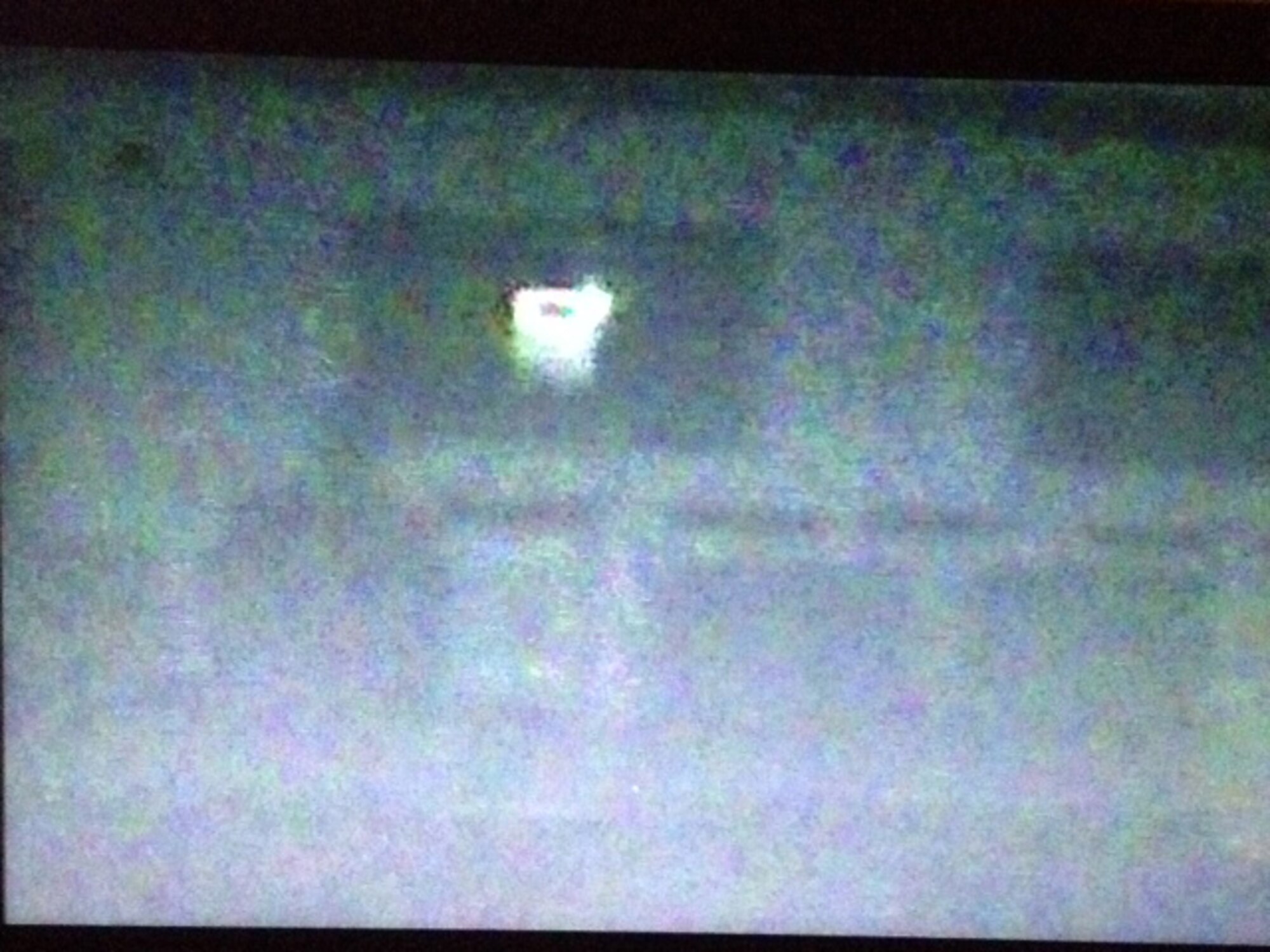 A camera captures what appears to be a shadowy figure (left side) sitting in one of several chairs lined up against a wall in a building on March Air Reserve Base Wednesday, Aug. 13, 2014. The image was captured during a nighttime paranormal investigation at the 96-year-old base. (Courtesy photo/Joe Mora)