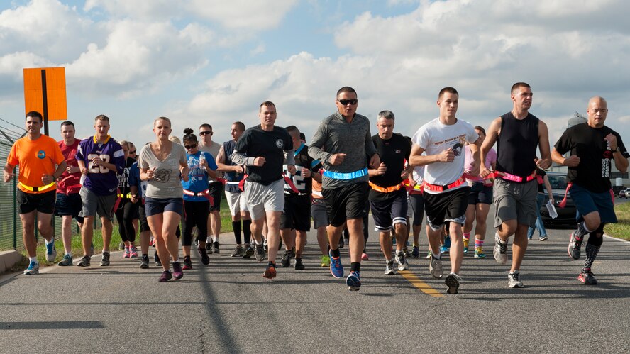 Runners take off moments after the start of the Zombies of Dover race Oct. 16, 2014, at Dover Air Force Base, Del. Forty-two runners took part in the race. (U.S. Air Force photo/Airman 1st Class Zachary Cacicia)