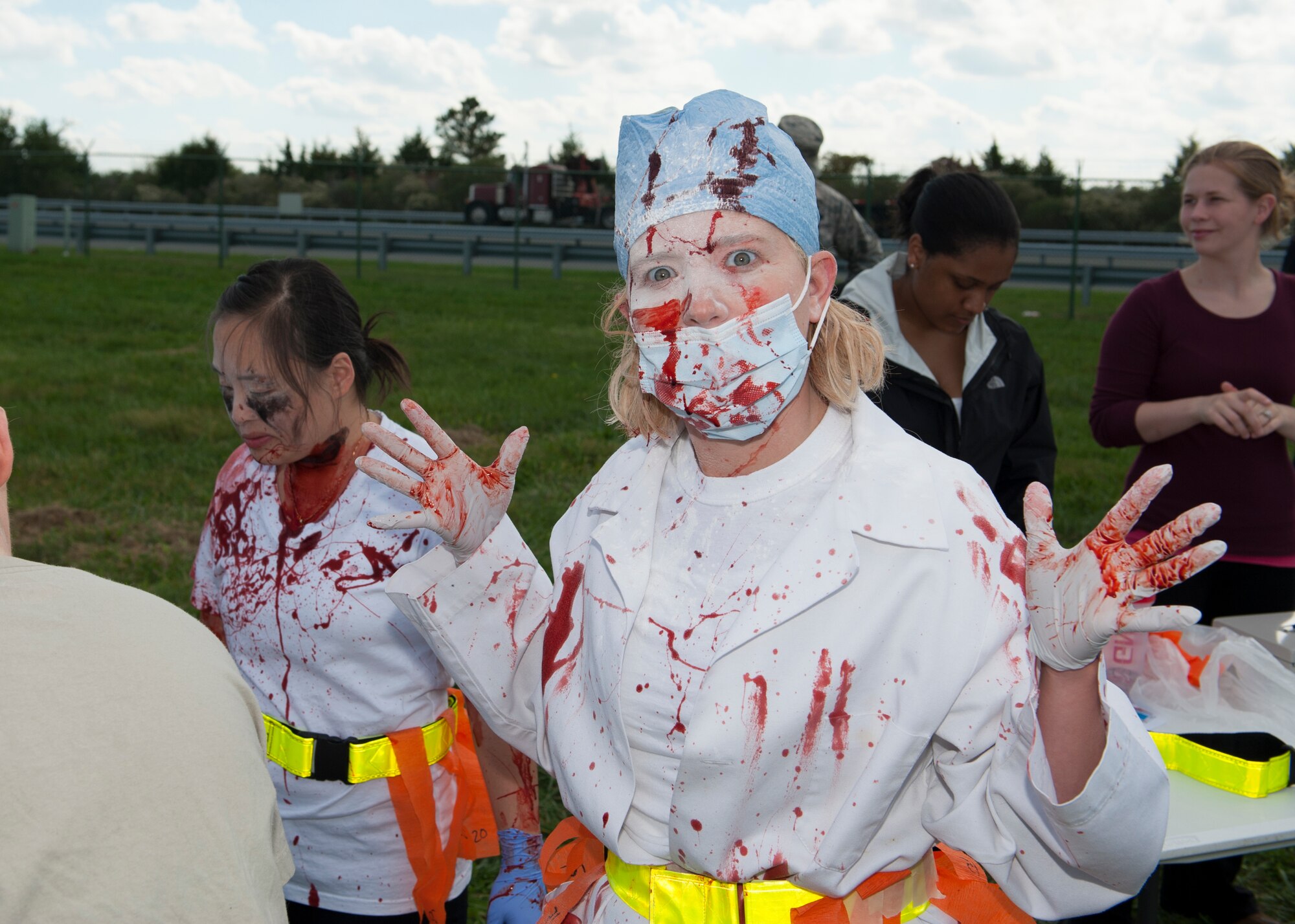 Capt. Kelley Hursh, 436th Dental Squadron general dentist, displays her zombie makeup prior to the Zombies of Dover race Oct. 16, 2014, at Dover Air Force Base, Del. Hursh, dressed as a zombie dentist for the race. (U.S. Air Force photo/Airman 1st Class Zachary Cacicia)