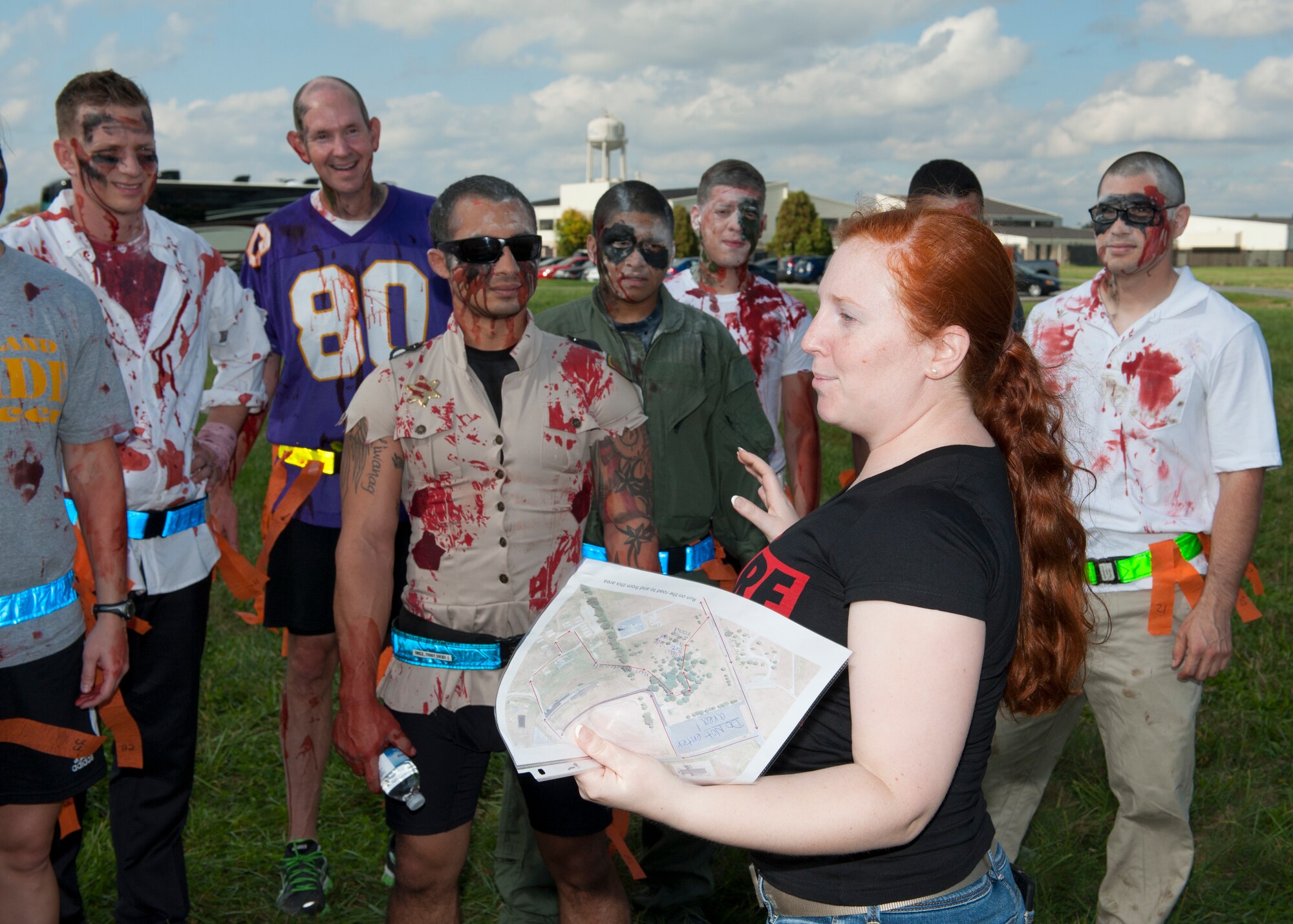 Staff Sgt. Nicole Hawley, 436th Mission Support Group executive support staff, discusses race rules to participants prior to the Zombies of Dover race Oct. 16, 2014, at Dover Air Force Base, Del. Hawley was the primary organizer for the race. (U.S. Air Force photo/Airman 1st Class Zachary Cacicia)