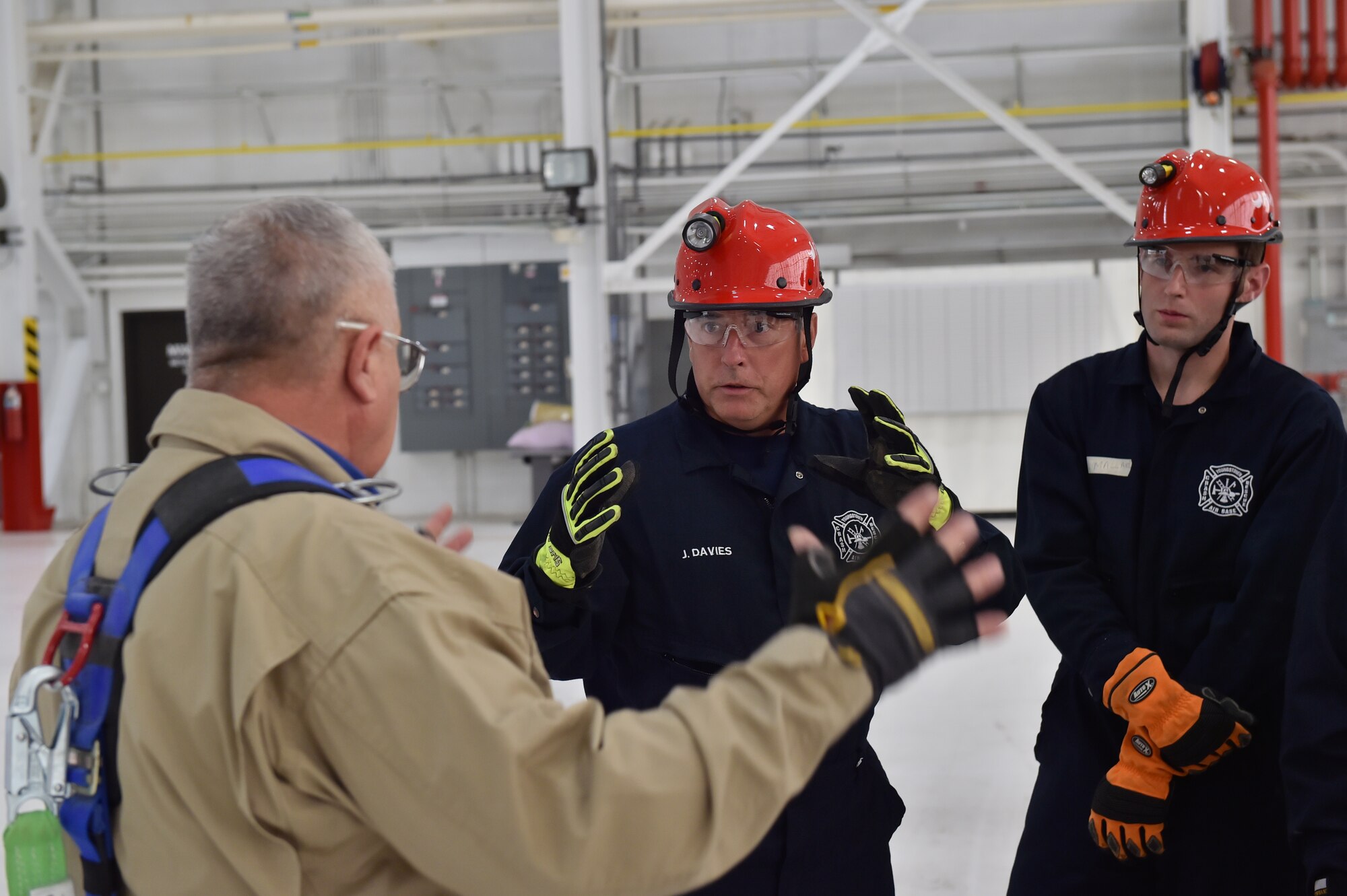 910th Airlift Wing Civil Engineer firefighter Joe Davies asks Ohio Fire Academy instructor Albert Gross a question about a grain augur during a grain bin rescue training course here, Oct. 17. As the first product of the Air Force Community Partnership Program at YARS, the Ohio Bureau of Worker’s Compensation worked with the Ohio State Fire Academy to bring their innovative grain bin rescue training platform to YARS, allowing first responders to gain potentially life-saving skills. Approximately 50 firefighters from several local fire departments, including 14 from the 910th Civil Engineer Fire Department here, participated. U.S. Air Force photo/Eric M. White
