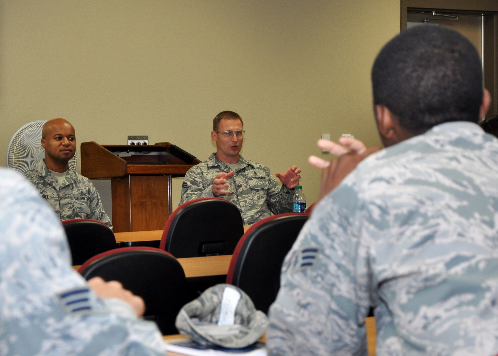 GOODFELLOW AIR FORCE BASE, Texas – Chief Master Sgt. Rye T. Bavin, 17th Medical Group superintendent, and Chief Master Sgt. Marcus A. Hall, 315th Training Squadron superintendent, speak to a group of junior enlisted Airmen during a chief panel at the Consolidated Learning Center Oct. 15. The panel took a variety of questions from the Airmen to include dining facility renovations, below the zone and living in the Air Force while raising a family. The Top 3 plans to host similar panels for NCOs, senior NCOs and company grade officers in the future. (U.S. Air Force photo/ Senior Airman Joshua Edwards)