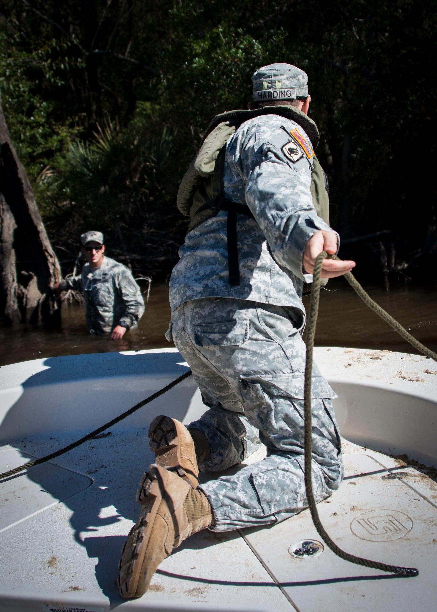 Rangers place the simulated missing victim in the water prior to the 6th Ranger Training Battalion’s annual major accident response exercise Oct. 16 at Eglin Air Force Base, Fla.  Medics and first responders from the 6th RTB, 96th Test Wing and the local area responded to boating and down aircraft scenarios deep within the Eglin range.  (U.S. Air Force photo/Tech. Sgt. Jasmin Taylor)